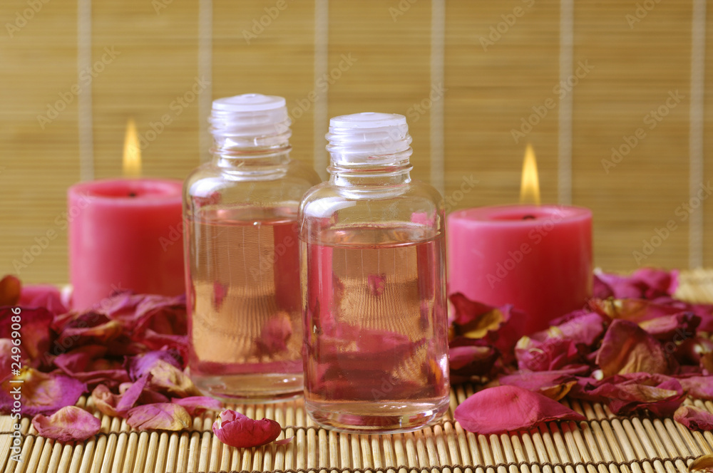 Spa background of oil and candle on bamboo mat Spa background of oil and candle on bamboo mat