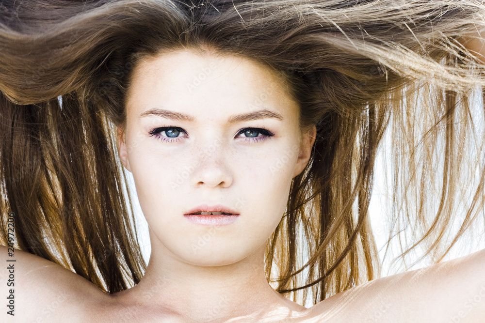 Obraz premium Beautiful girl with luxuriant hair