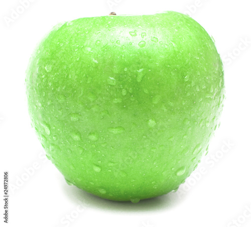 wet green apple covered by water drops on white background