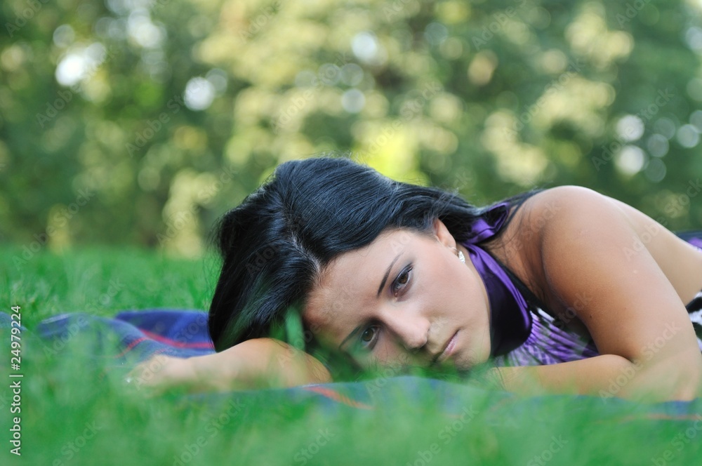 © Martinan - Very sad - young woman in grass