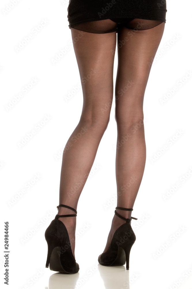 Woman wearing high heels on white background Woman wearing high heels on white background