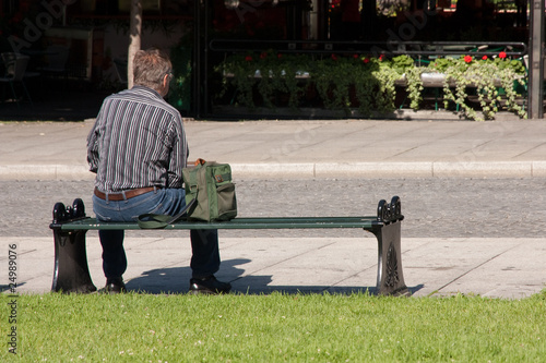 A man waiting on a bench