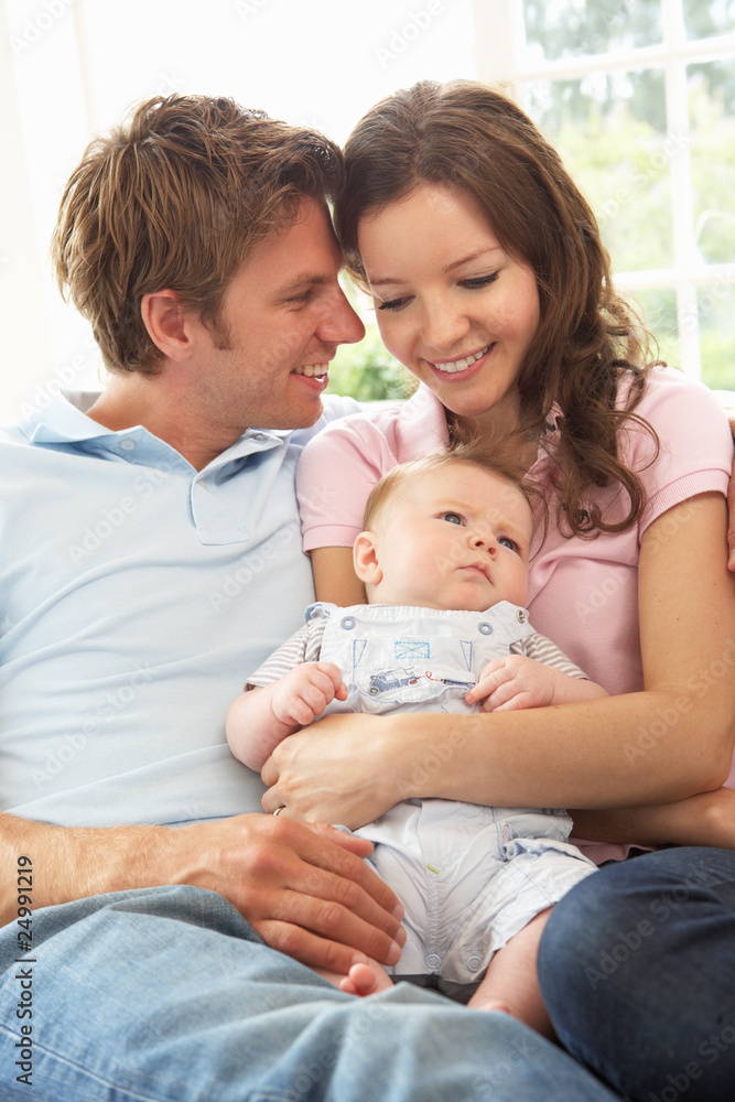 Parents Cuddling Newborn Baby Boy At Home Parents Cuddling Newborn Baby Boy At Home