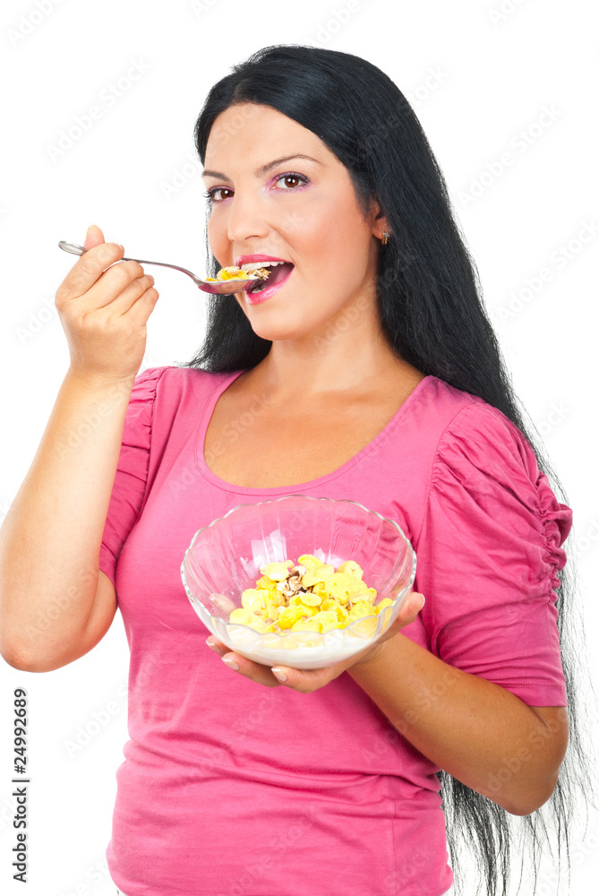 Healthy woman eating cornflakes cereals Healthy woman eating cornflakes cereals
