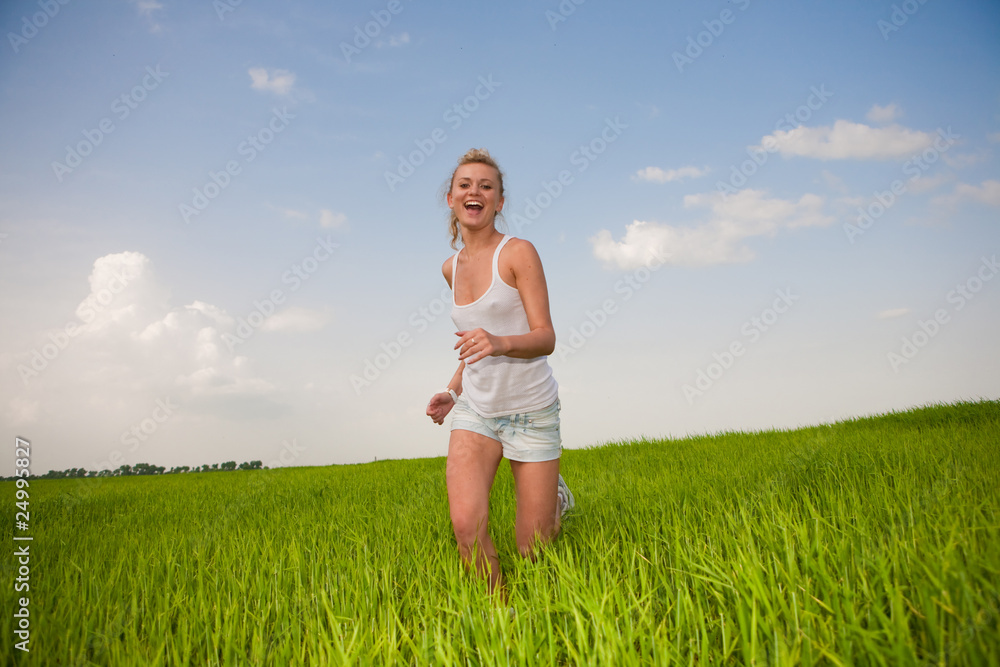 Happy young women runing in field Happy young women runing in field