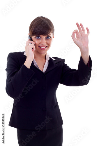 woman with phone and ok gesture