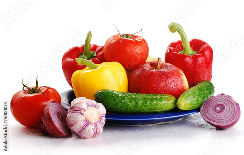 Composition with wet raw vegetables isolated on white