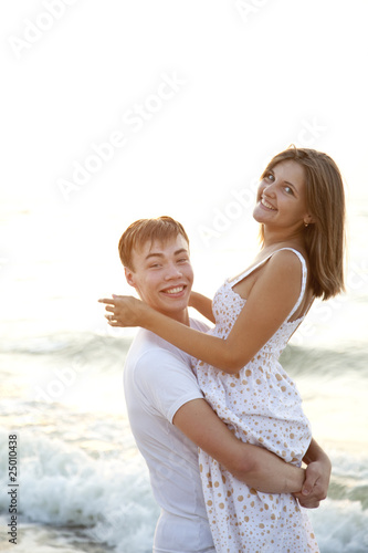 Closeup portrait of happy couple enjoying vacations on the beach © Masson