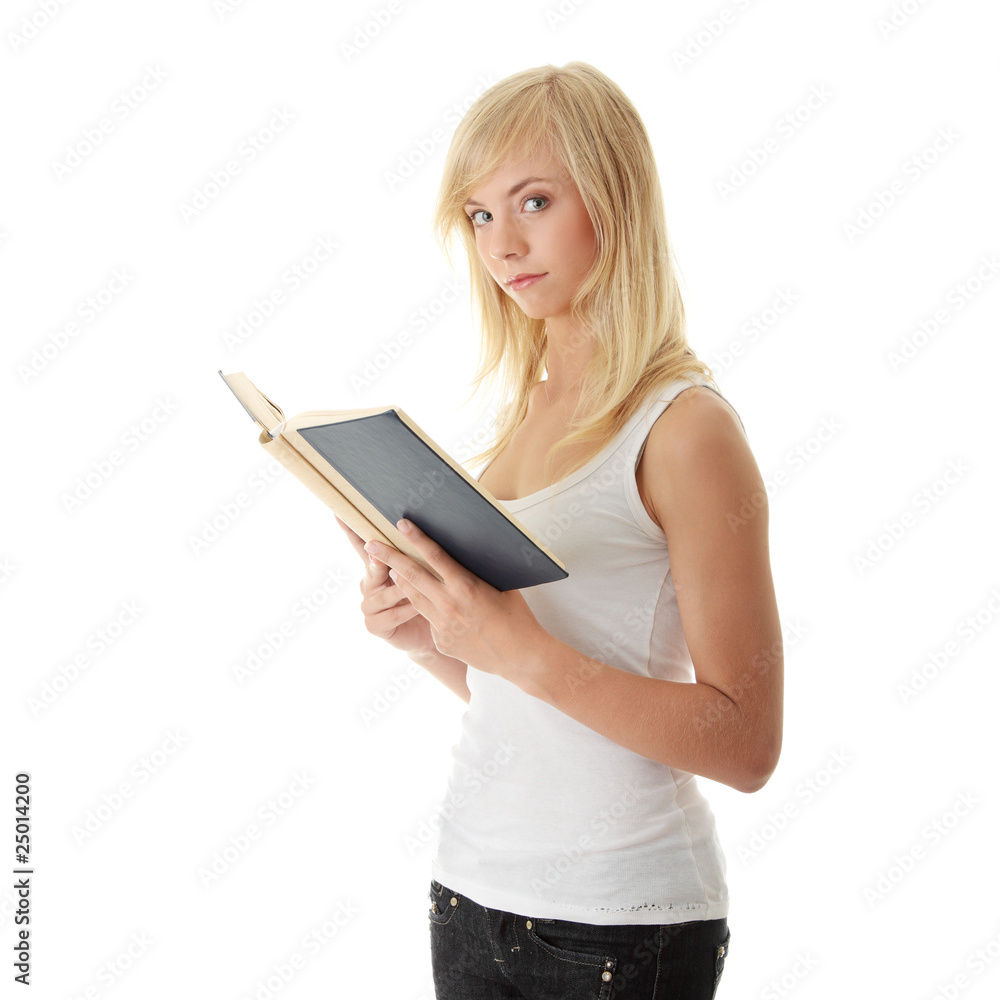 Teen woman reading book