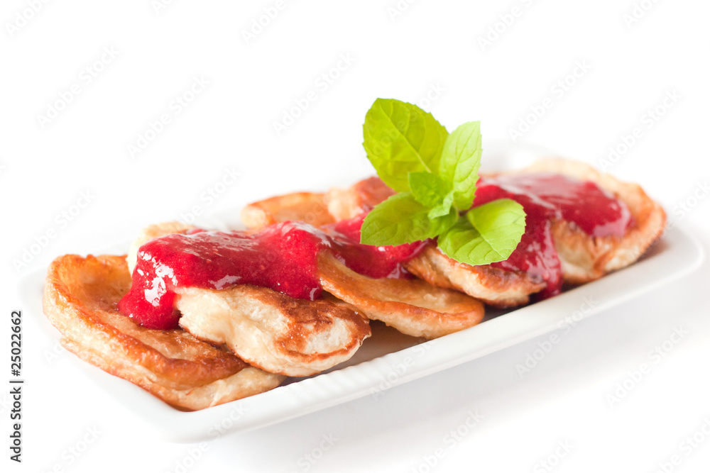 Pancakes with fresh raspbery sauce and mint
