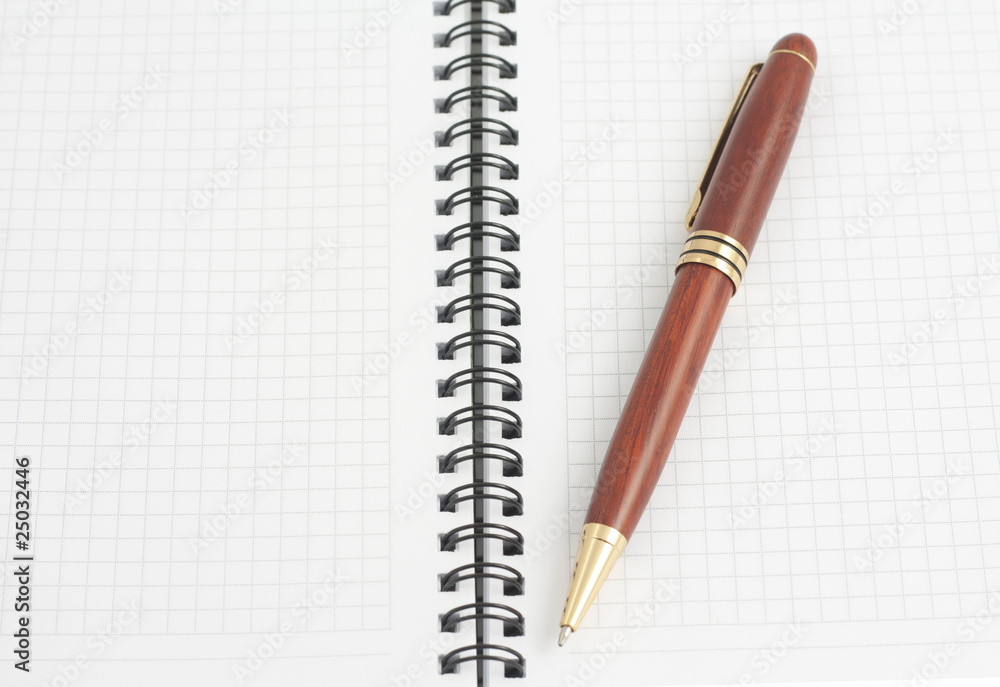 Pen on a clean sheets of spiral notebook, The top view Pen on a clean sheets of spiral notebook, The top view