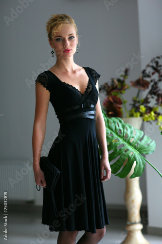 Beautiful young woman in interior