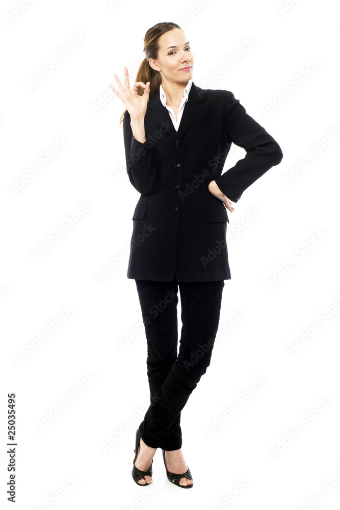 young businesswoman with her hand indicating ok young businesswoman with her hand indicating ok