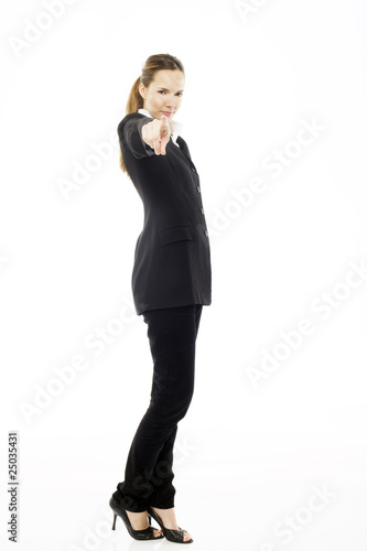 Young businesswoman standing with her hand indicating