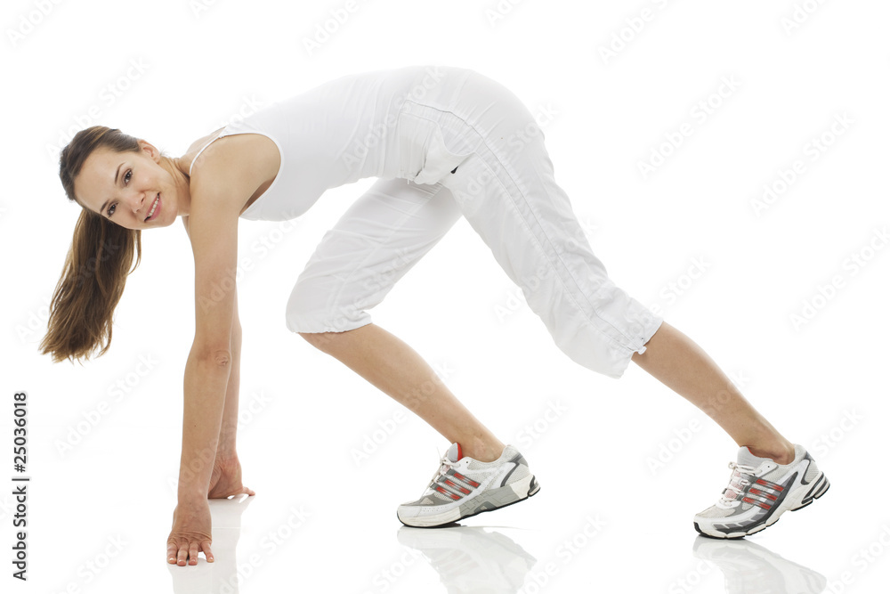 Young woman doing gymnastics on white background studio