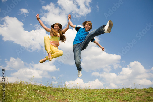 Girl and boy jumping. Soft focus. Focus on eyes