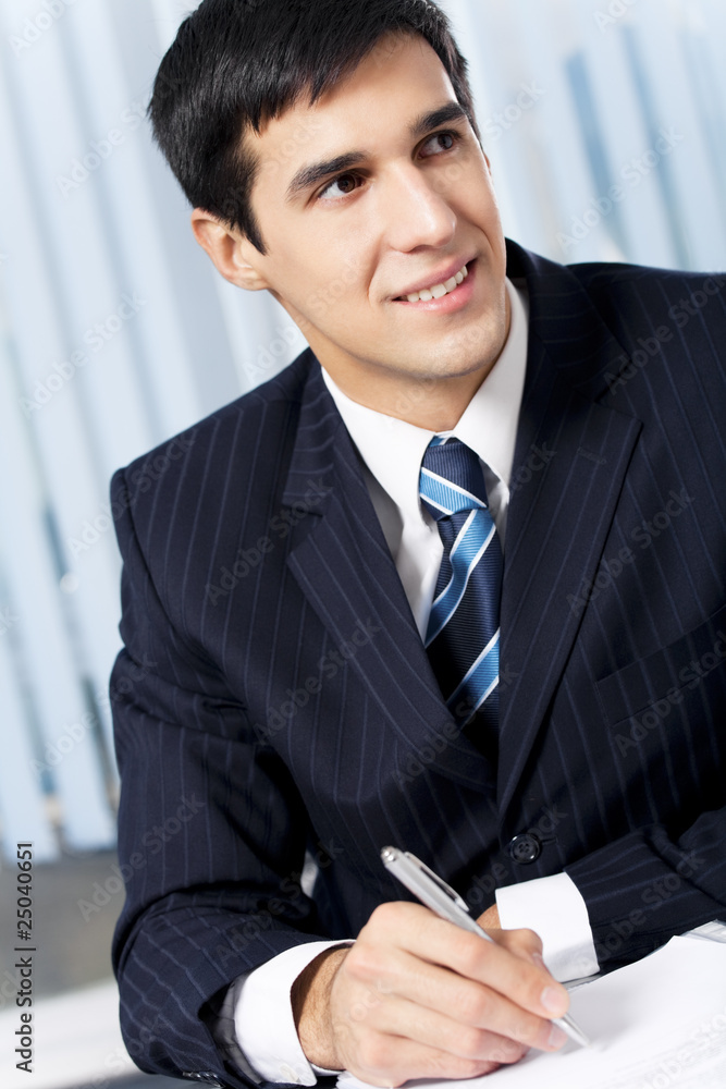 Successful businessman with documents at office Successful businessman with documents at office