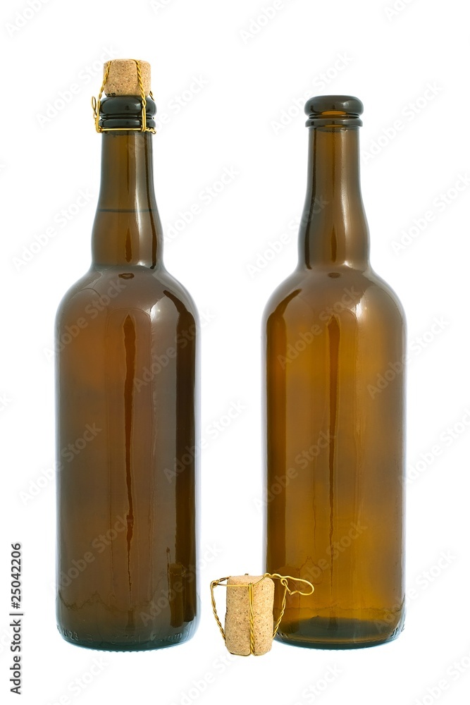 Two dark glass beer bottles and cork. Isolated on white Two dark glass beer bottles and cork. Isolated on white