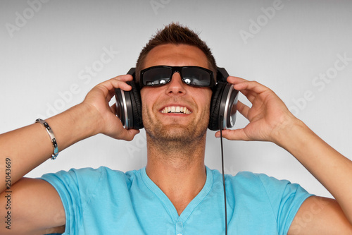 Young man in sunglasses with headphones