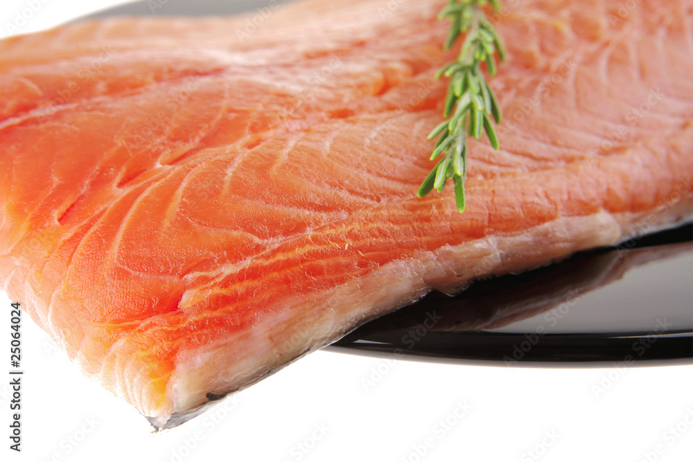 fresh raw salmon fillet on black with rosemary fresh raw salmon fillet on black with rosemary