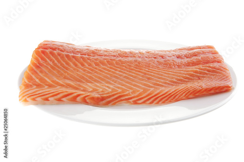 big salmon fillet on white plate