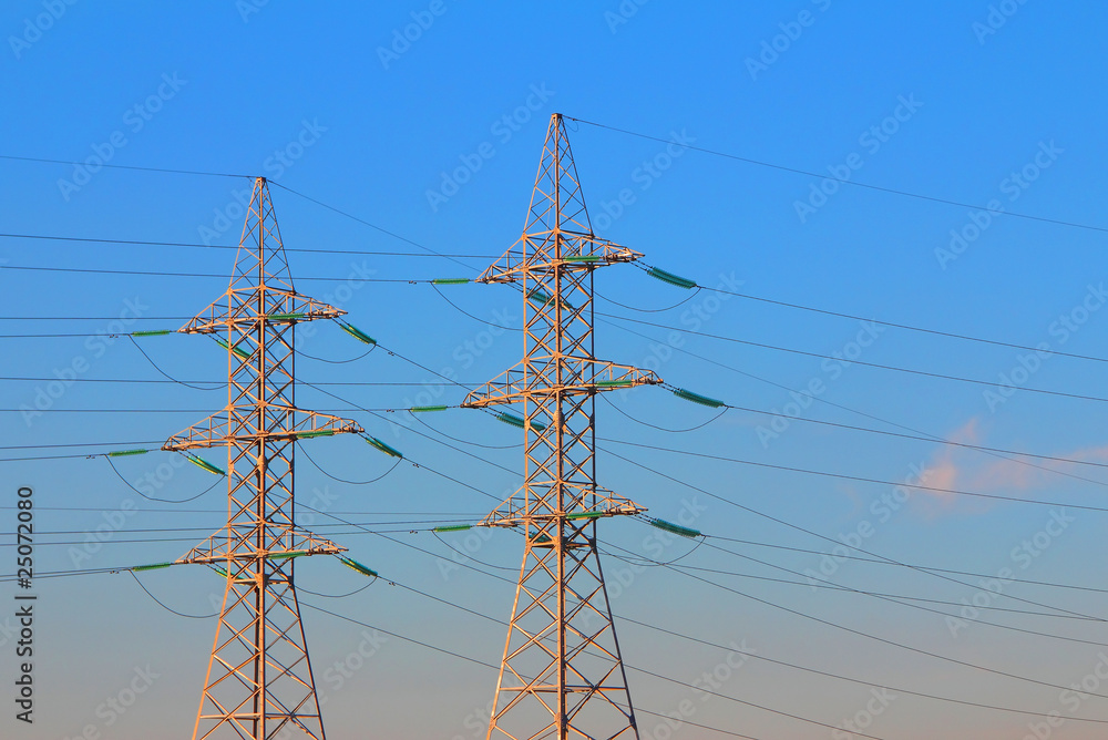 electric power transmission towers at sunrise electric power transmission towers at sunrise
