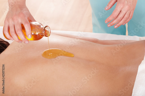 Young woman having thai massage.