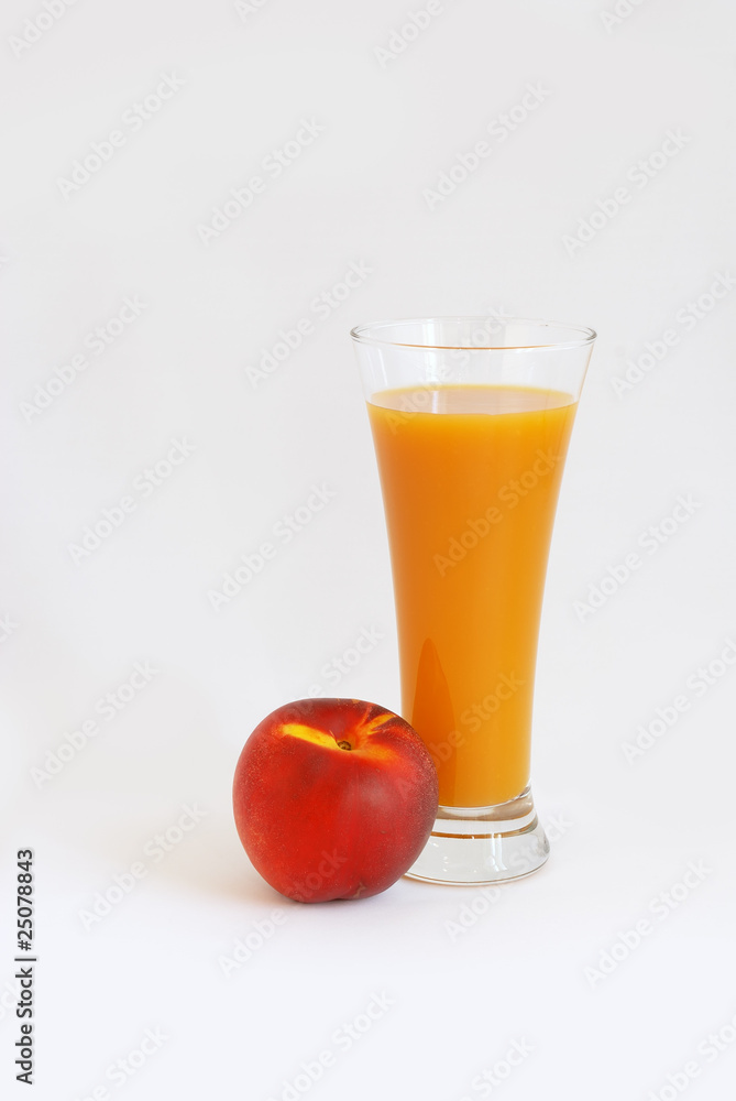 Glass of juice and peach Glass of juice and peach