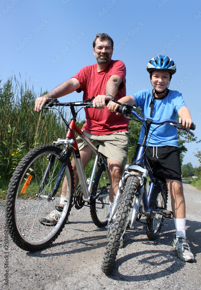 father and son biking