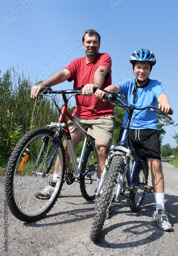 father and son biking