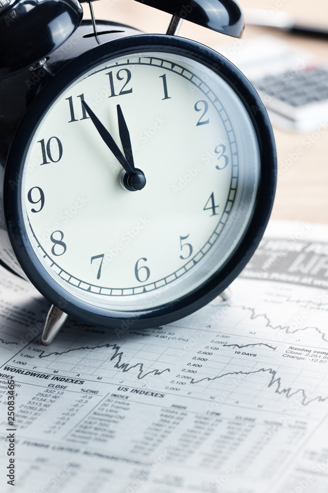 alarm clock on financial graph.last moment alarm clock on financial graph.last moment