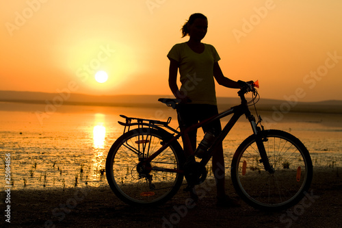 Girl with bicycle. © Alex Ishchenko