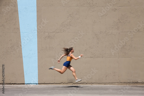 Muscular woman sprints to win photo