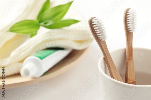 Closeup of wooden toothbrush with towel photo