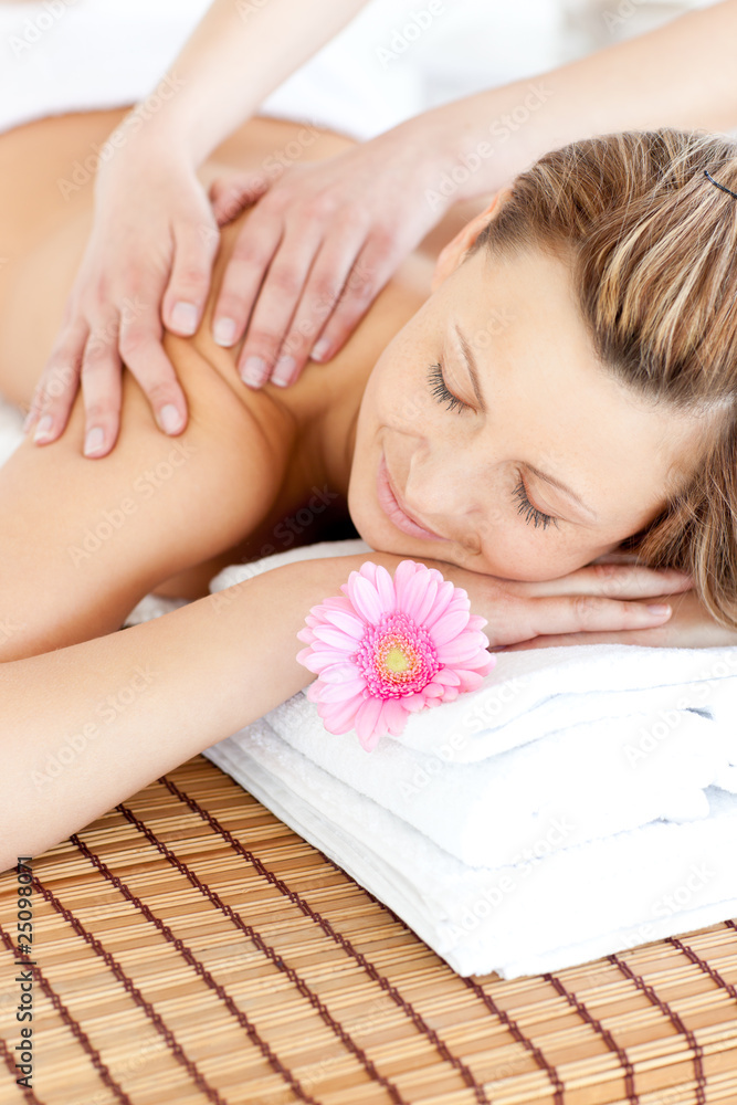Relaxed young woman having a back massage Relaxed young woman having a back massage