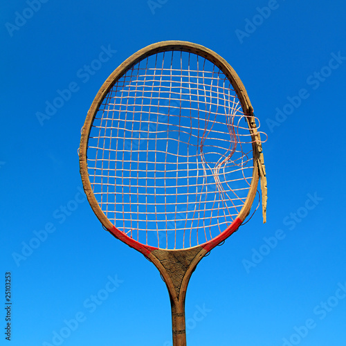 aging racket on celestial background