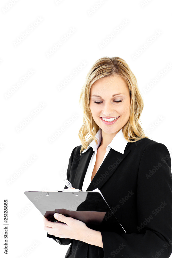 Positive businesswoman holding a clipboard standing Positive businesswoman holding a clipboard standing