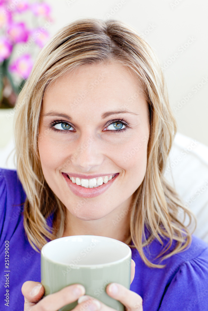 Portrait of a caucasian blond woman enjoying her coffee sitting Portrait of a caucasian blond woman enjoying her coffee sitting