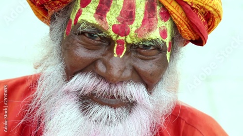 Portrait of a old Sadhu at the ghats in Varanasi, India. photo