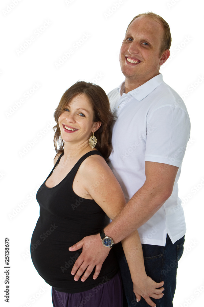 Young couple standing in studio setting isolated over white back Young couple standing in studio setting isolated over white back