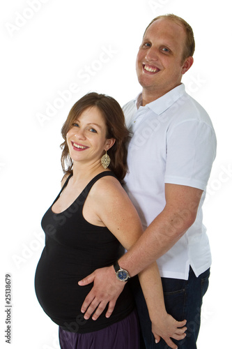 Young couple standing in studio setting isolated over white back