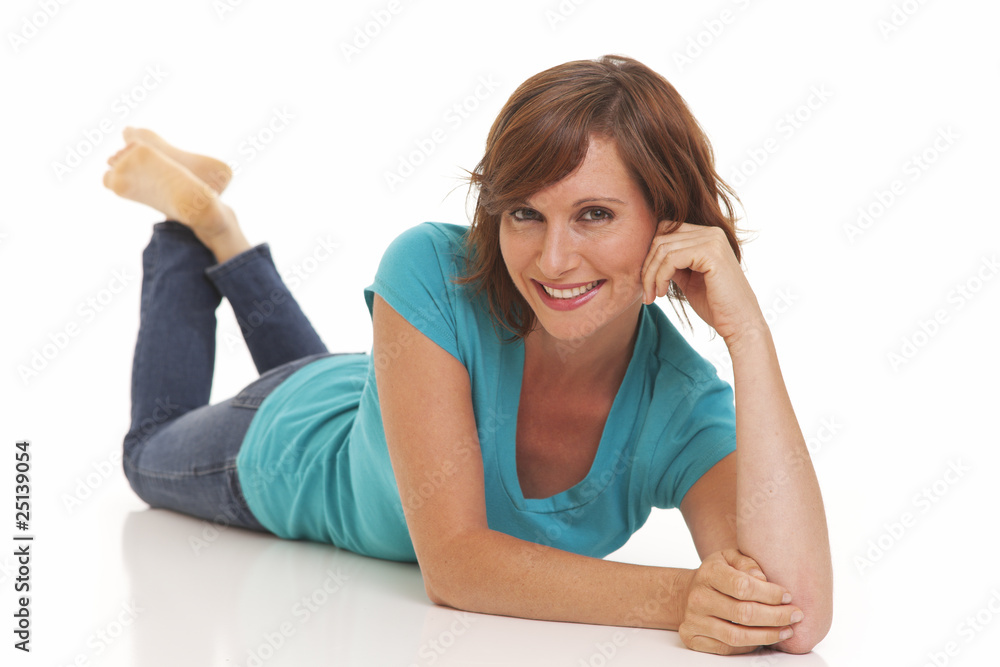 Young woman casually laying on floor with jeans Young woman casually laying on floor with jeans