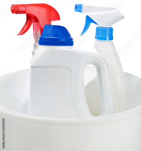 cleaning bottles in white bucket