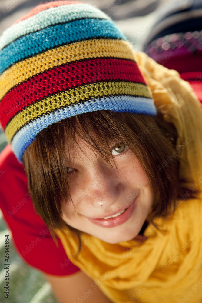 Close-up view at teen girl in rasta cap. Close-up view at teen girl in rasta cap.