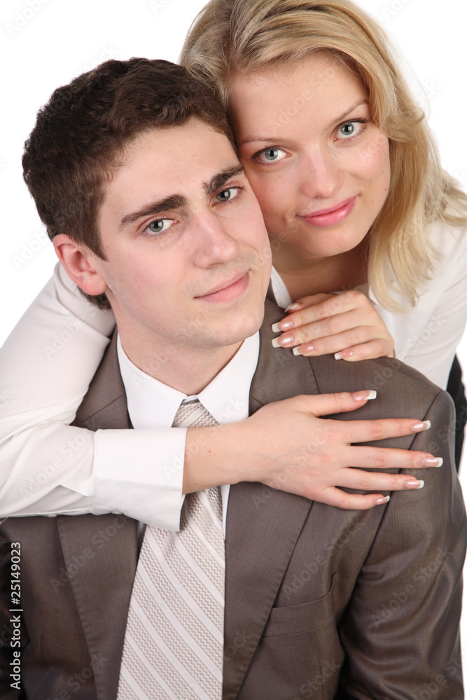 beautiful girl with long hair embraces the young man. beautiful girl with long hair embraces the young man.
