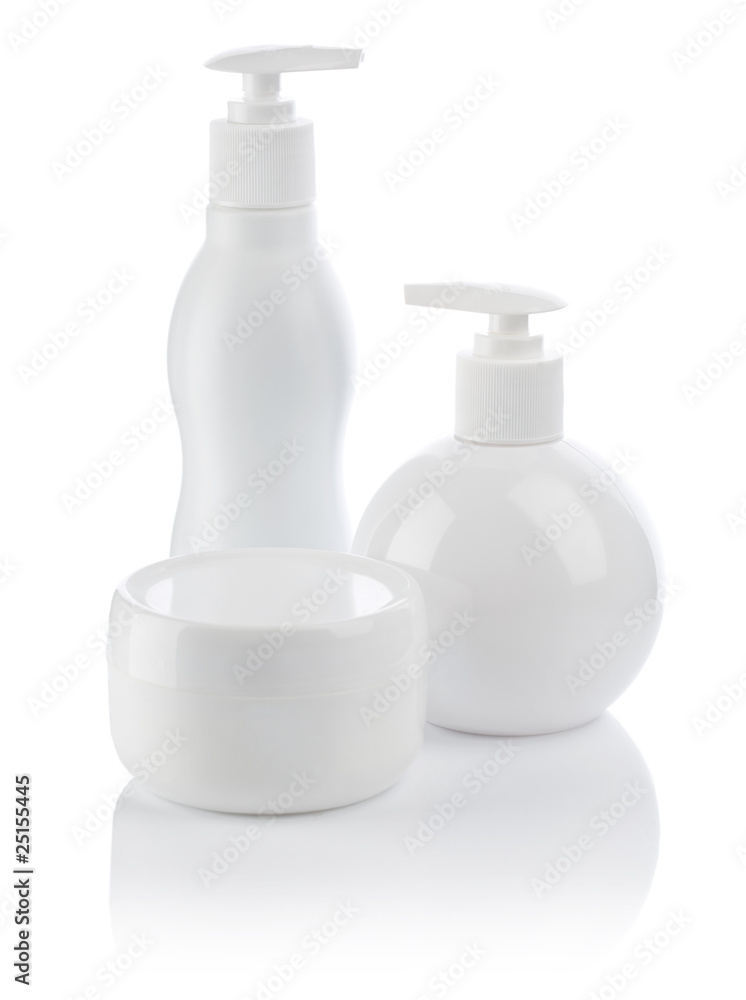 white cosmetical spray bottle and cream