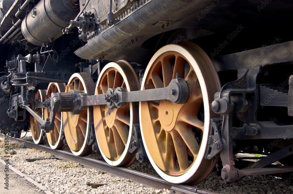 Fototapeta premium Old locomotive wheels close up. Steam train.