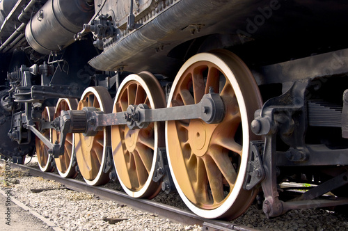 Old locomotive wheels close up. Steam train.