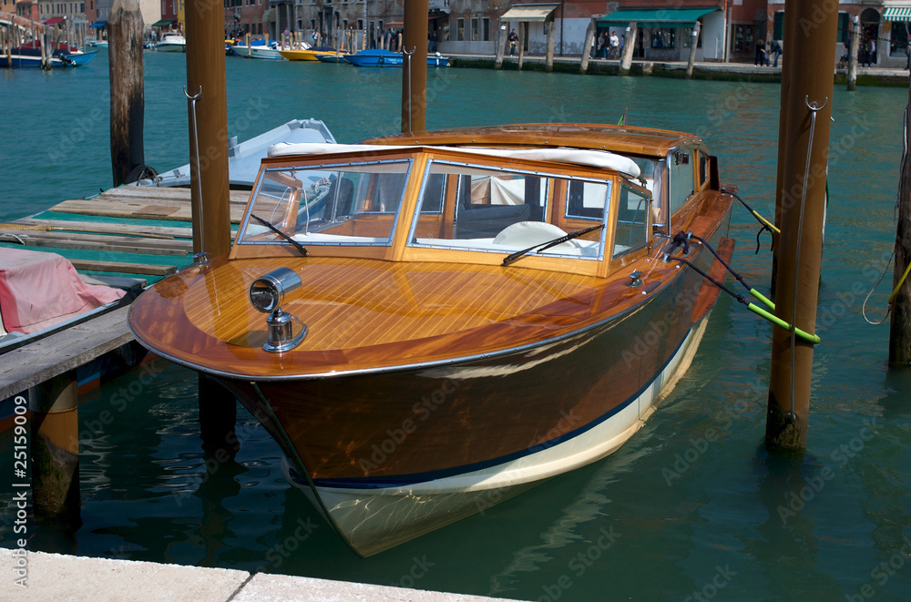 A shiny polished wooden boat