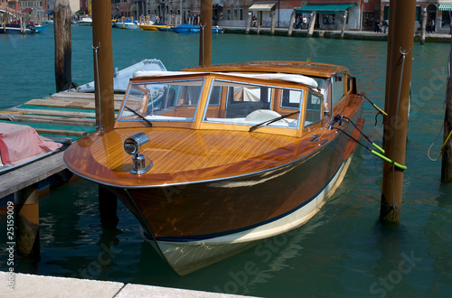 A shiny polished wooden boat © juat